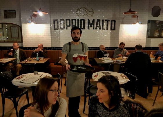 Doppio Malto Rome is a brew restaurant near the Trevi fountain serving craft beers, burgers, grilled meats and great desserts in a post-industrial space.